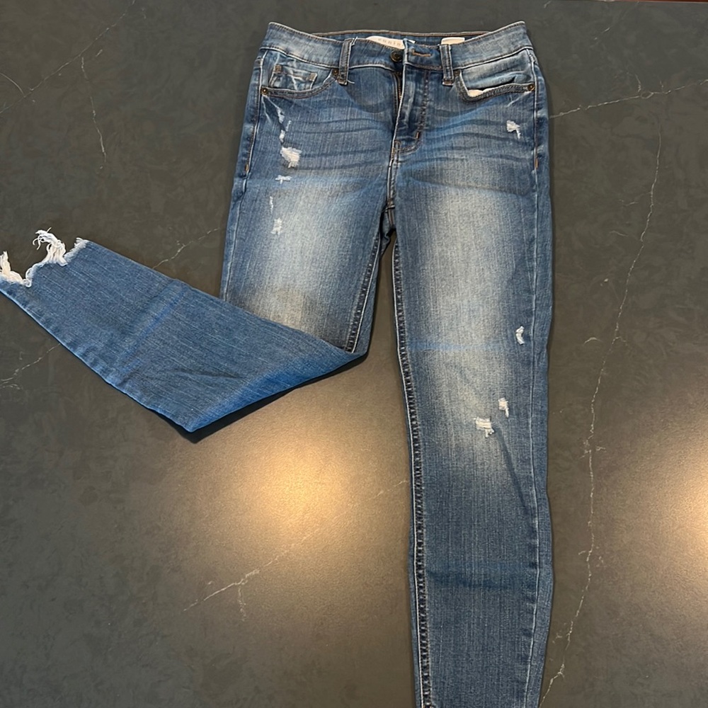 flattering high rise skinny jeans with destroyed detail on bottom